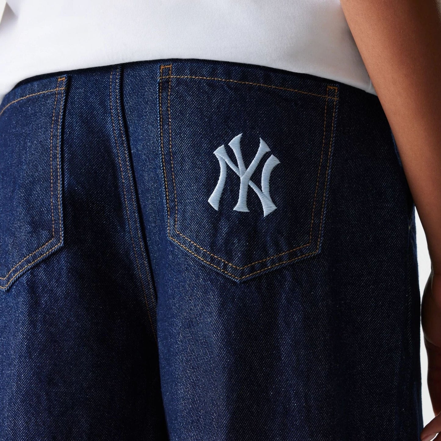 The Female model is wearing New York Yankees Womens MLB Dark Blue Wide Leg Denim Trousers 5