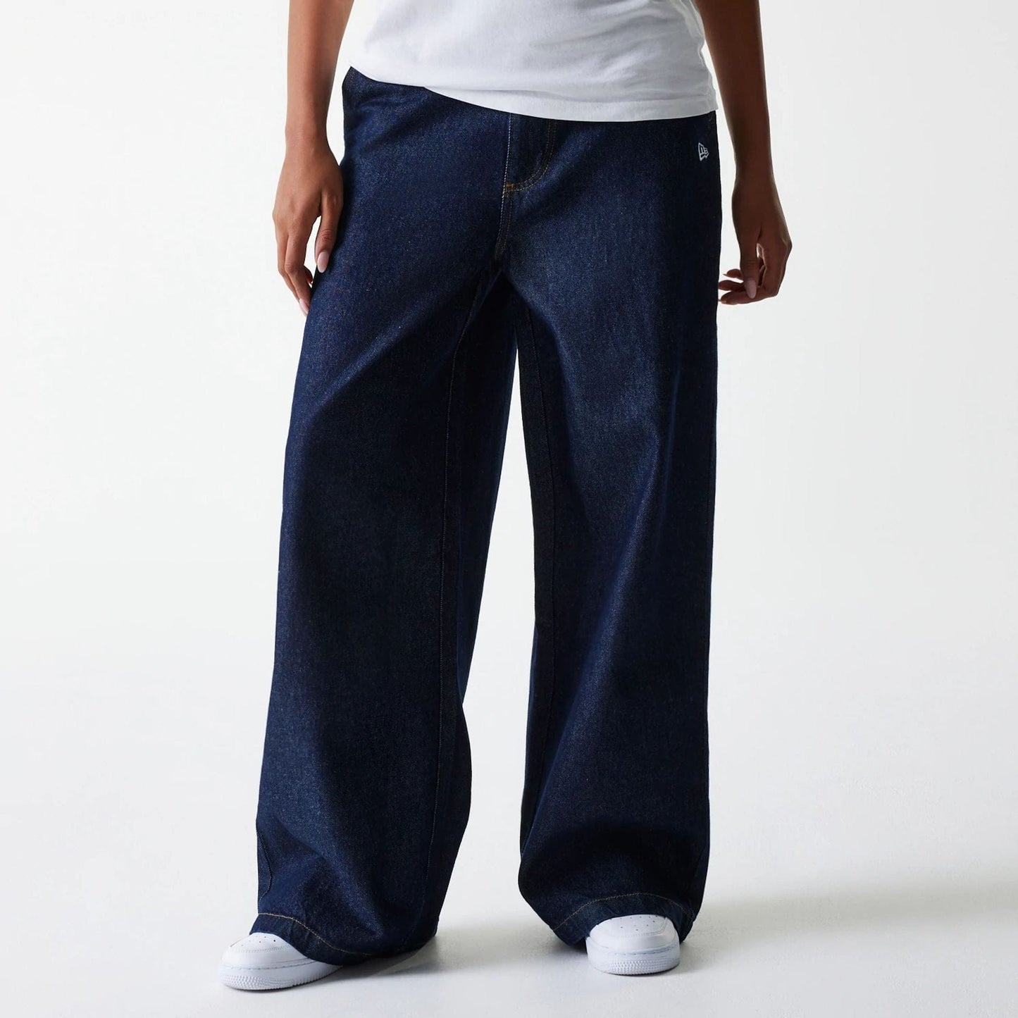 The Female model is wearing New York Yankees Womens MLB Dark Blue Wide Leg Denim Trousers 4