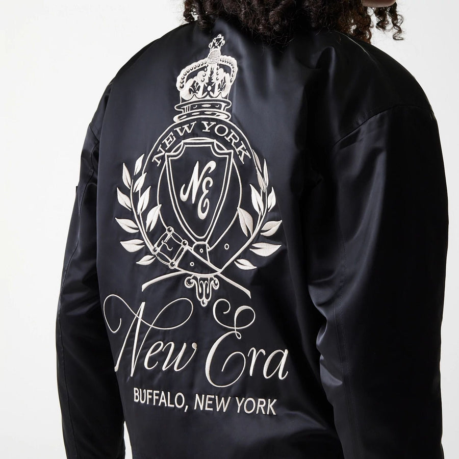 The Female model is wearing Womens New Era Satin Black Satin Bomber Jacket 4