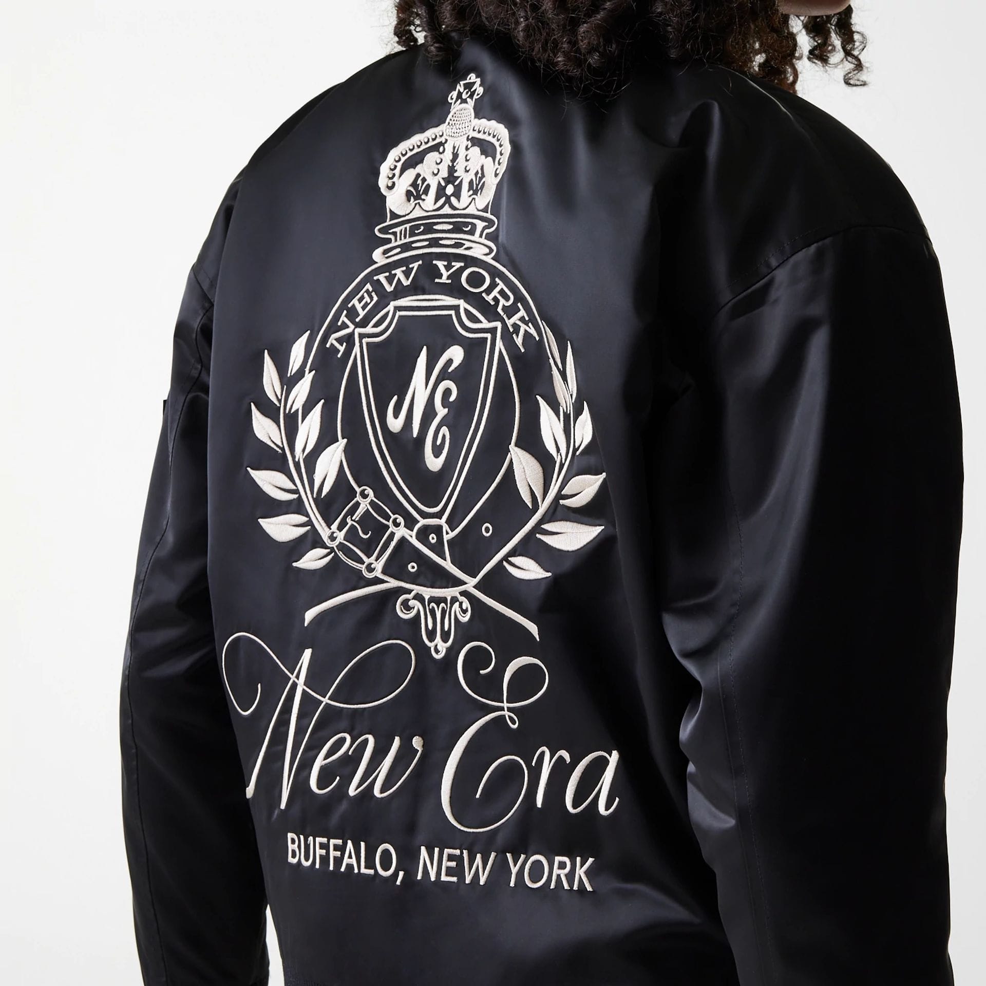 The Female model is wearing Womens New Era Satin Black Satin Bomber Jacket 4