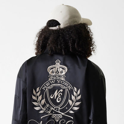 The Female model is wearing Womens New Era Satin Black Satin Bomber Jacket 5