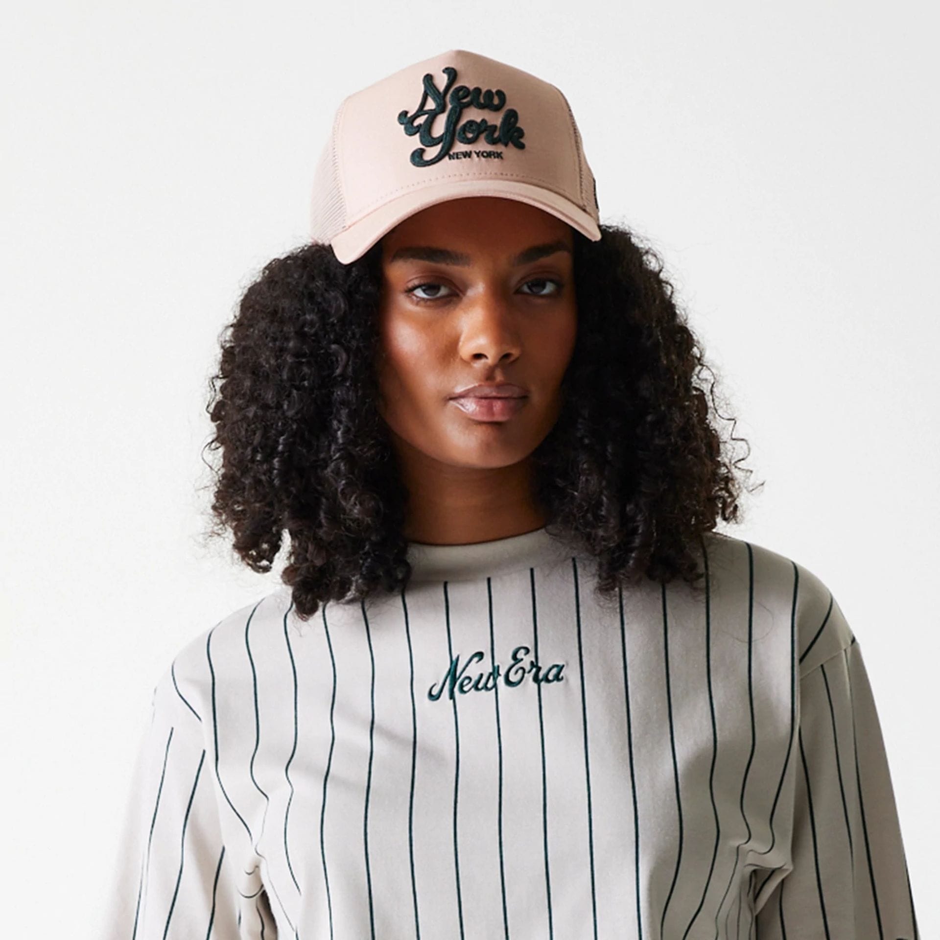 The Female model is wearing Womens New Era Pinstripe Light Beige Crop T-Shirt 5