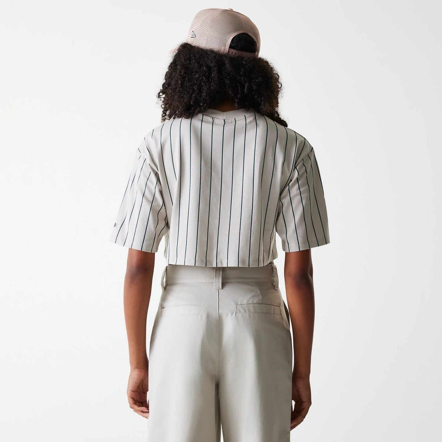 The Female model is wearing Womens New Era Pinstripe Light Beige Crop T-Shirt 2