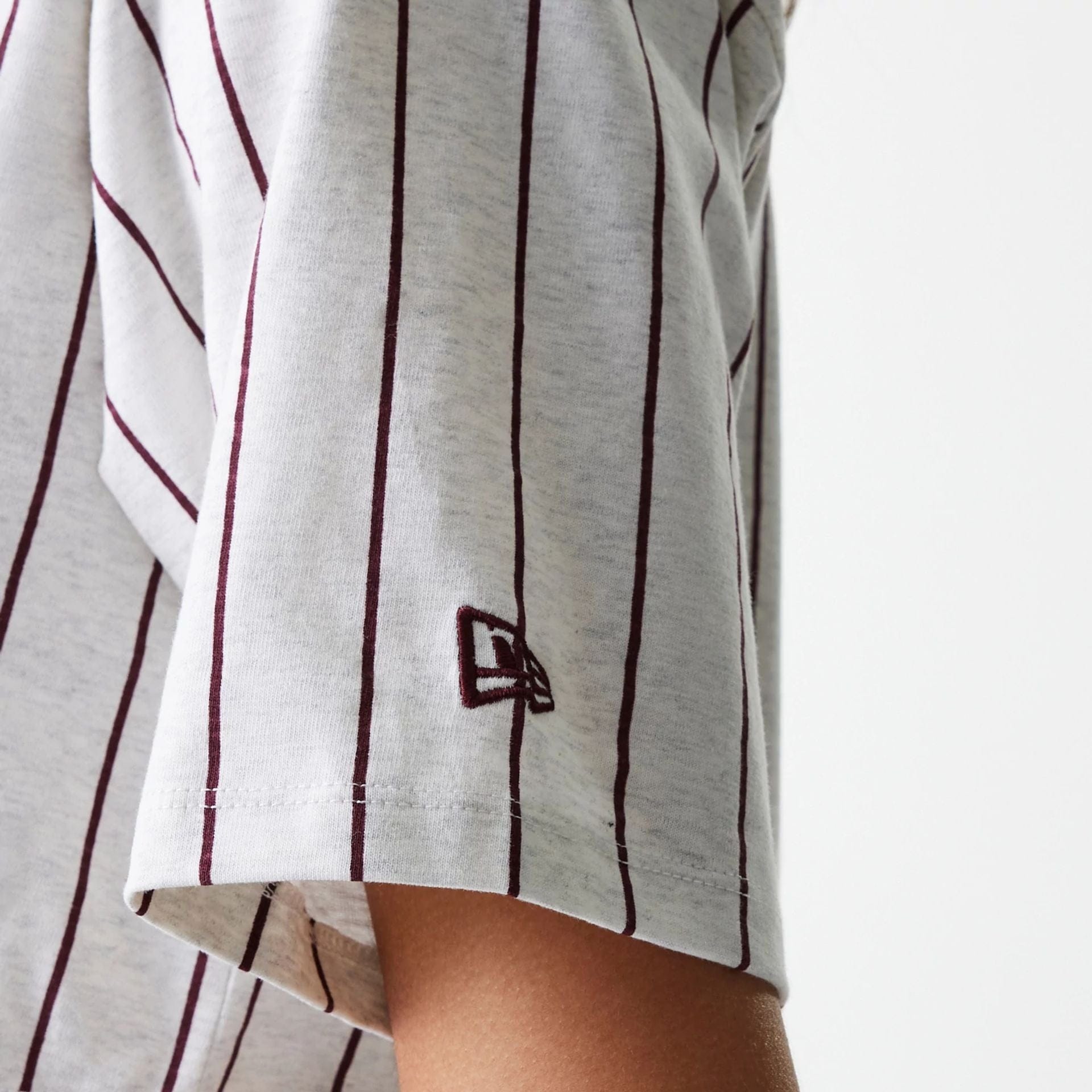 The Female model is wearing Womens New Era Pinstripe Pastel Grey Crop T-Shirt 4