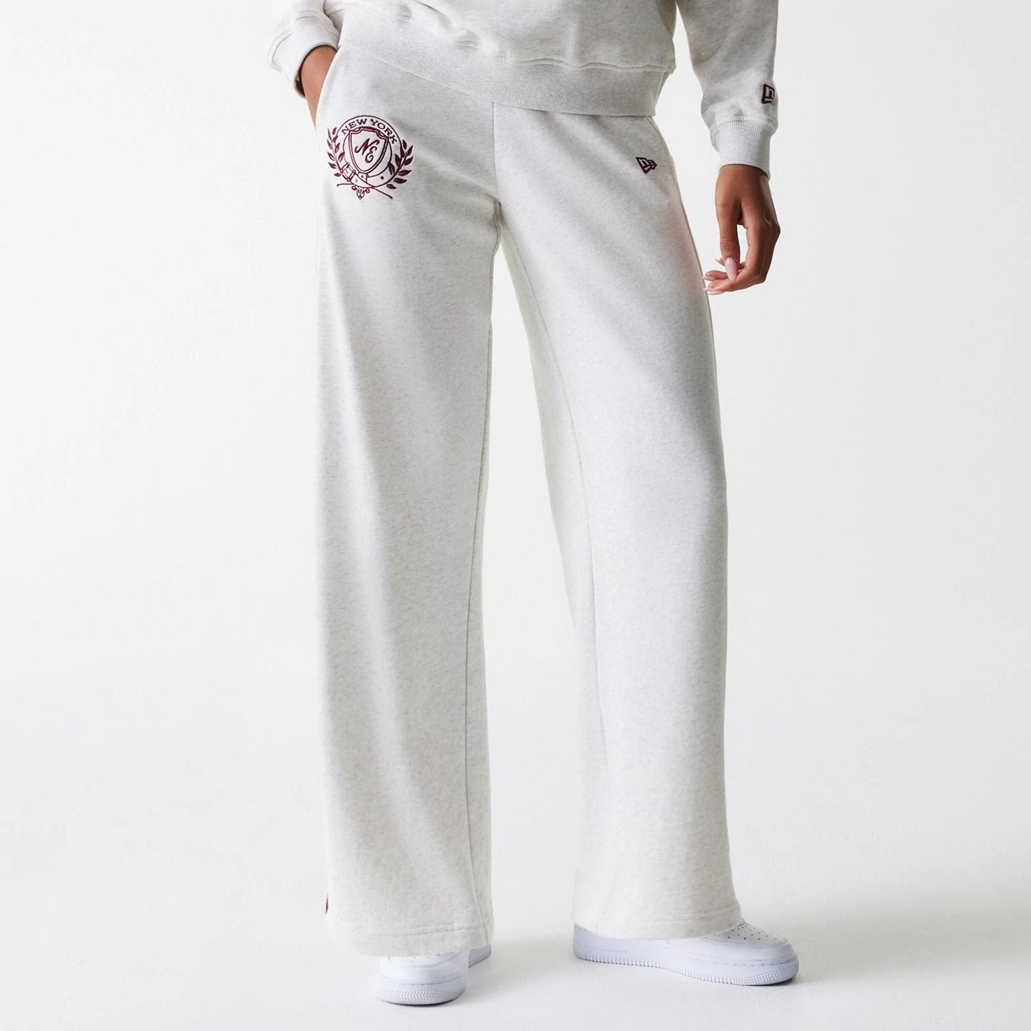 The Female model is wearing Womens New Era Pastel Grey Straight Leg Joggers 1