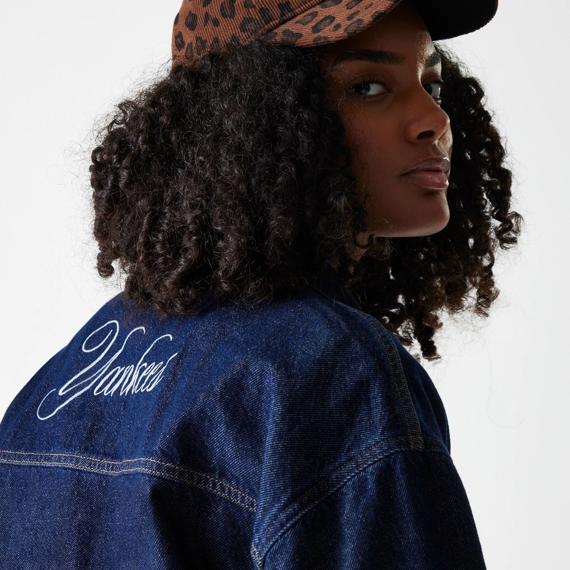 The Female model is wearing New York Yankees Womens MLB Dark Blue Denim Jacket 6