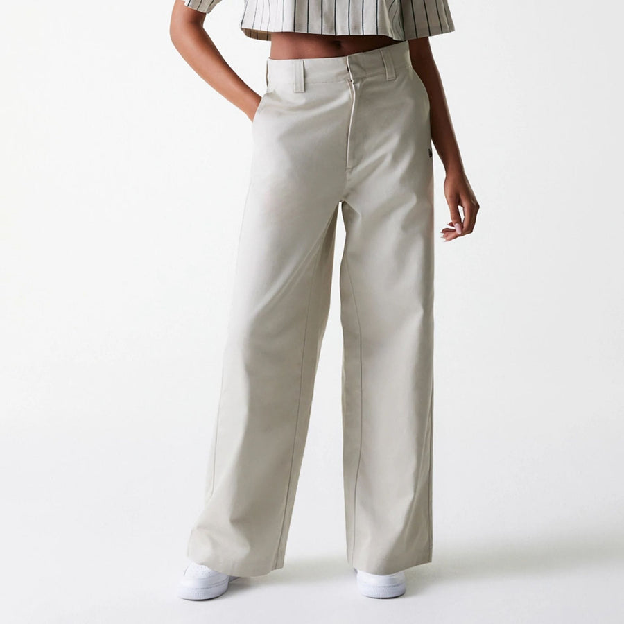 The Female model is wearing Womens New Era Light Beige Wide Leg Chino Trousers 1