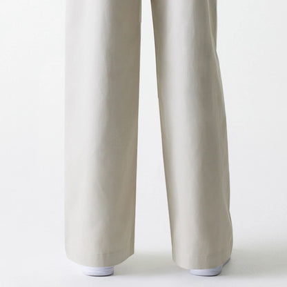 The Female model is wearing Womens New Era Light Beige Wide Leg Chino Trousers 3