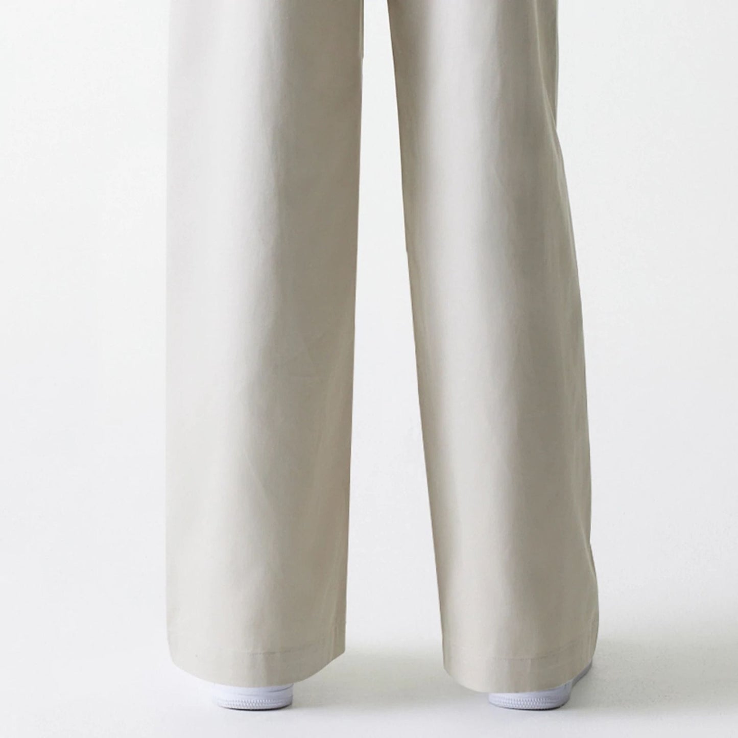 The Female model is wearing Womens New Era Light Beige Wide Leg Chino Trousers 3