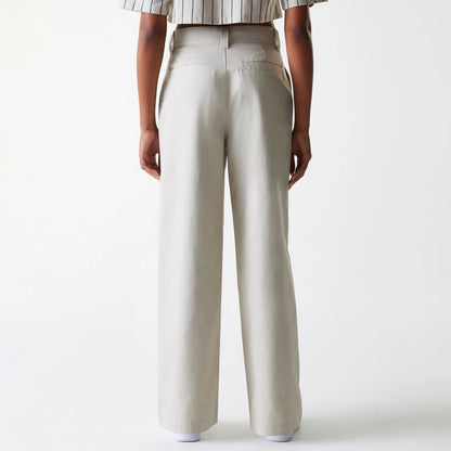 The Female model is wearing Womens New Era Light Beige Wide Leg Chino Trousers 2