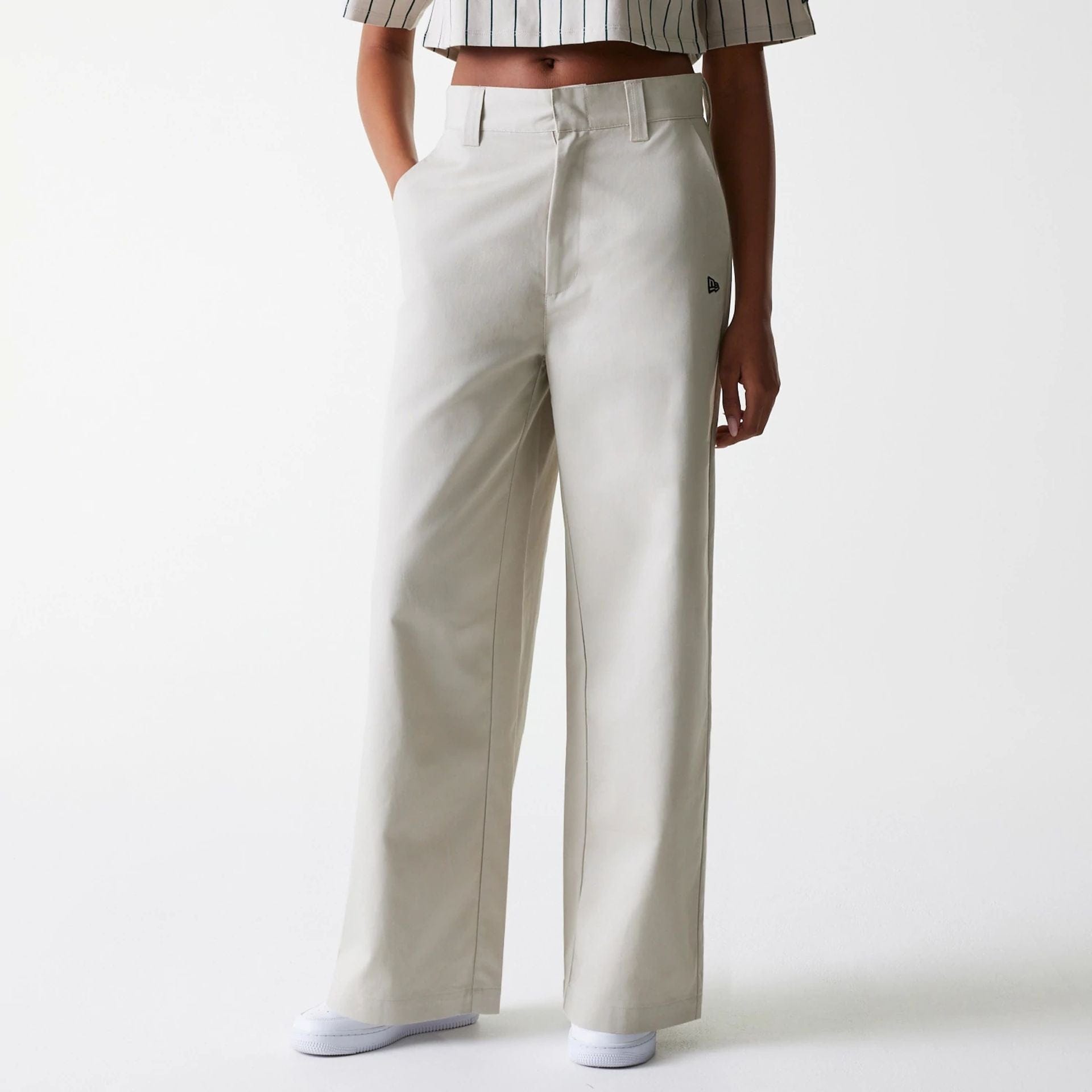 The Female model is wearing Womens New Era Light Beige Wide Leg Chino Trousers 4
