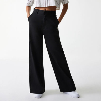 The Female model is wearing Womens New Era Black Wide Leg Chino Trousers 3