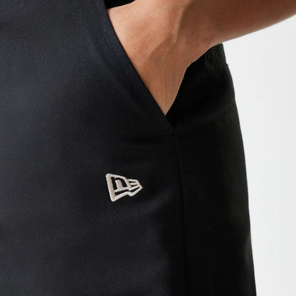 The Female model is wearing Womens New Era Black Wide Leg Chino Trousers 5