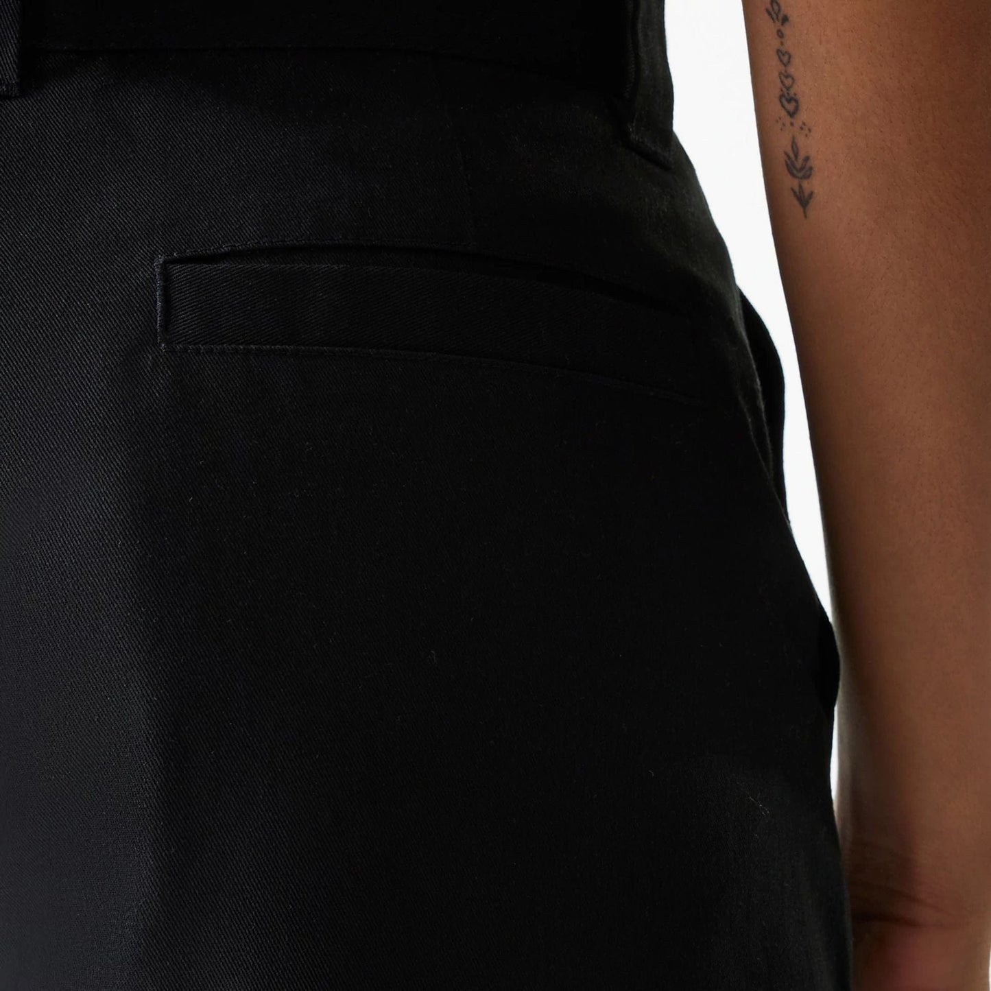 The Female model is wearing Womens New Era Black Wide Leg Chino Trousers 6