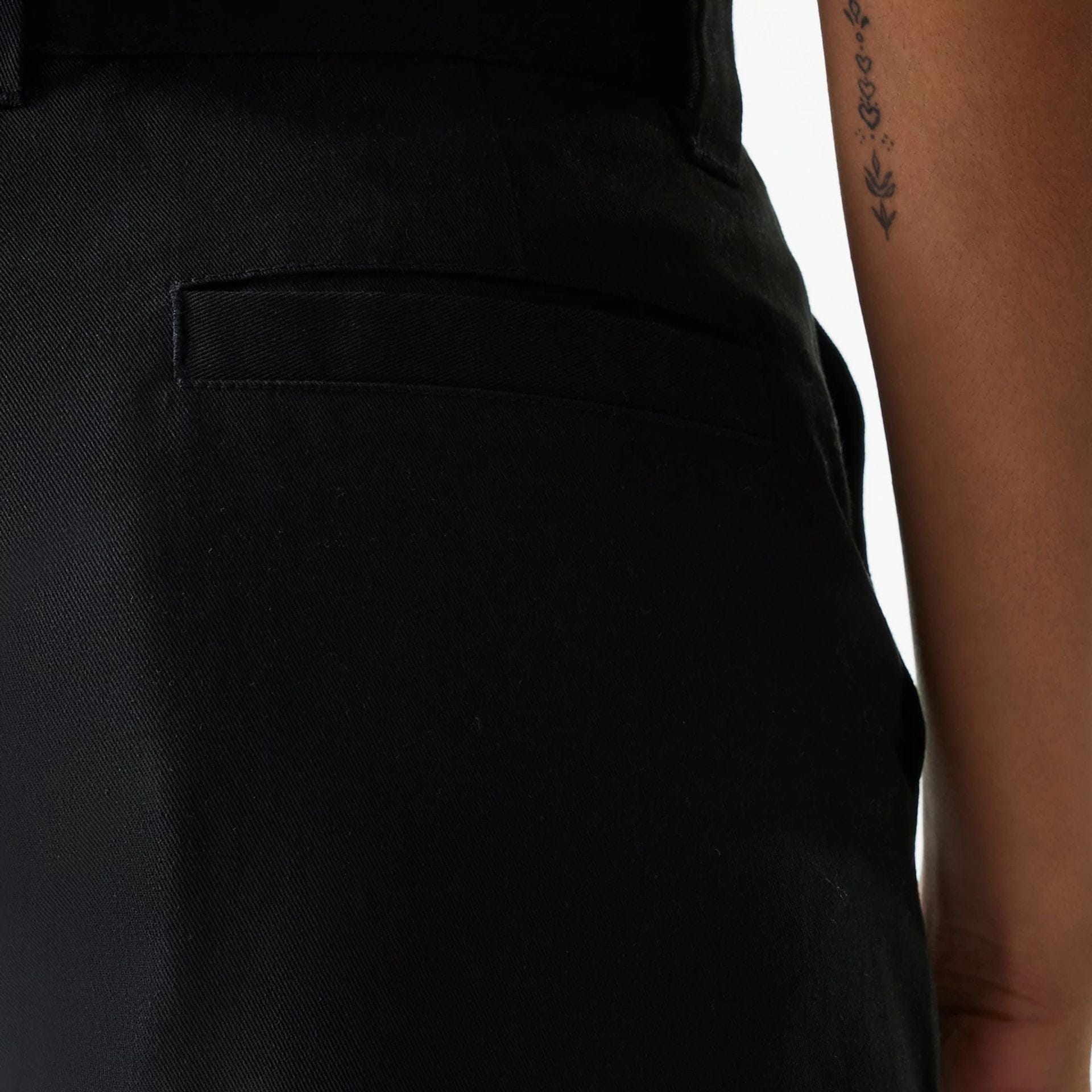 The Female model is wearing Womens New Era Black Wide Leg Chino Trousers 6