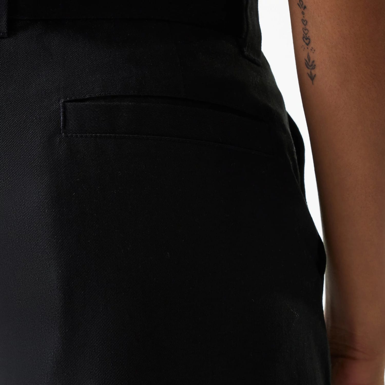 The Female model is wearing Womens New Era Black Wide Leg Chino Trousers 6