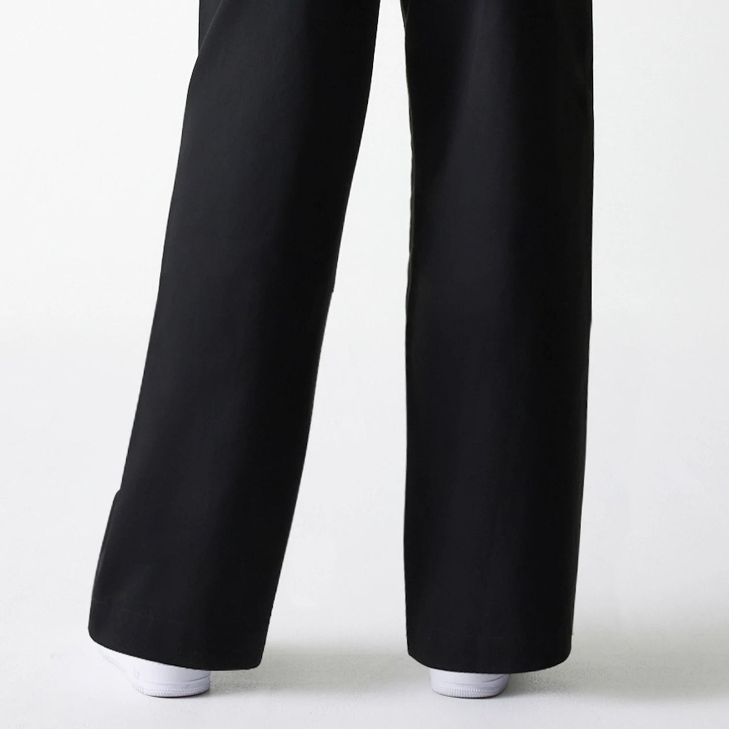 The Female model is wearing Womens New Era Black Wide Leg Chino Trousers 7