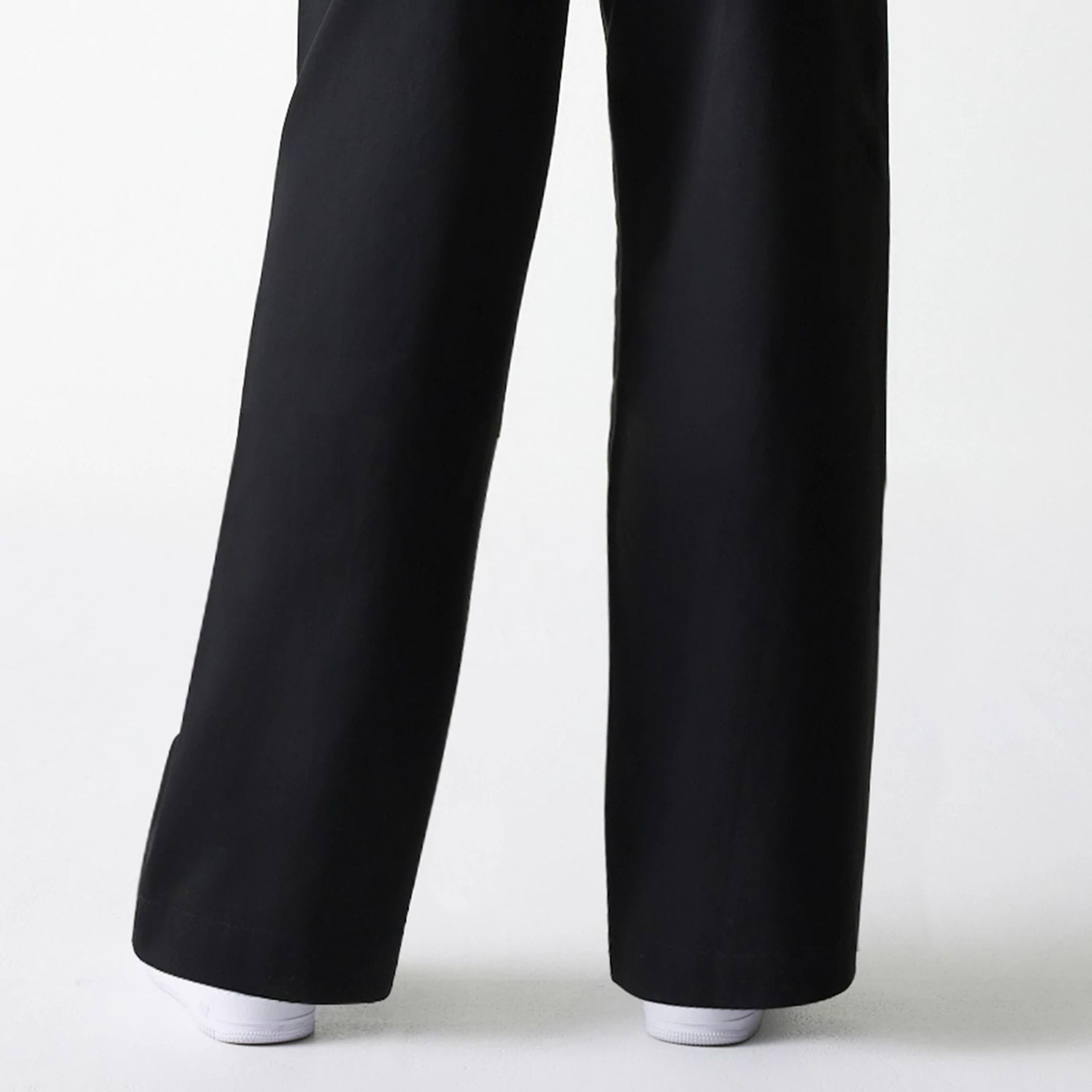 The Female model is wearing Womens New Era Black Wide Leg Chino Trousers 7