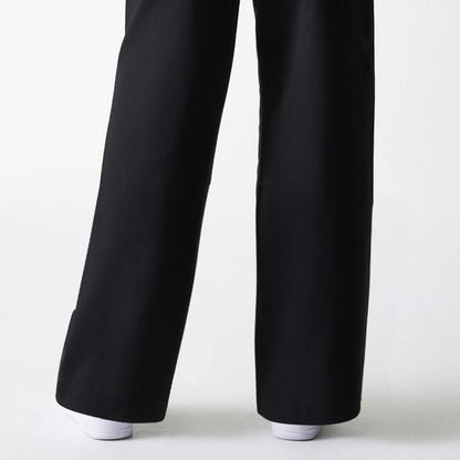The Female model is wearing Womens New Era Black Wide Leg Chino Trousers 7