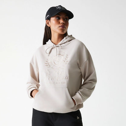 The Female model is wearing Womens New Era Crest Light Beige Pullover Hoodie 3
