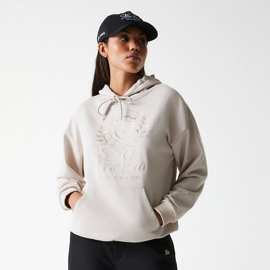 The Female model is wearing Womens New Era Crest Light Beige Pullover Hoodie 3