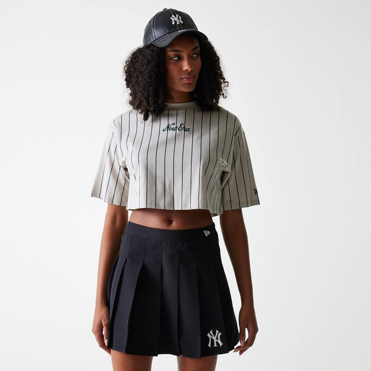 The Female model is wearing New York Yankees Womens MLB Black Tennis Skirt 1
