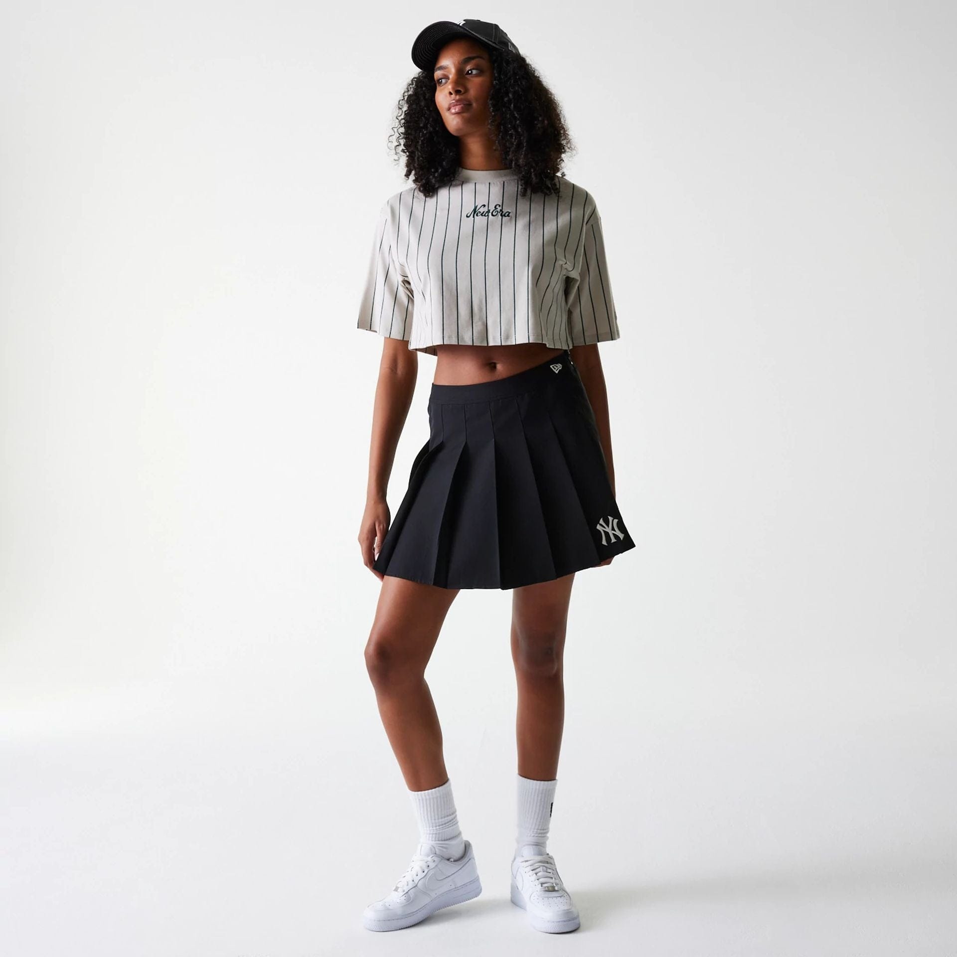 The Female model is wearing New York Yankees Womens MLB Black Tennis Skirt 8