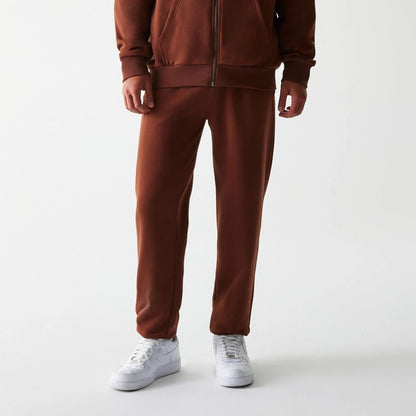 The Male model is wearing New York Yankees MLB Midi League Essential Brown Joggers 6