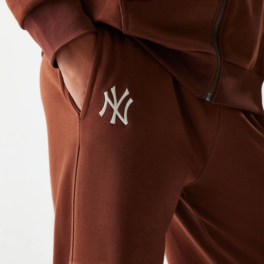 The Male model is wearing New York Yankees MLB Midi League Essential Brown Joggers 3