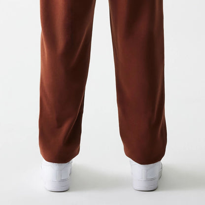 The Male model is wearing New York Yankees MLB Midi League Essential Brown Joggers 7