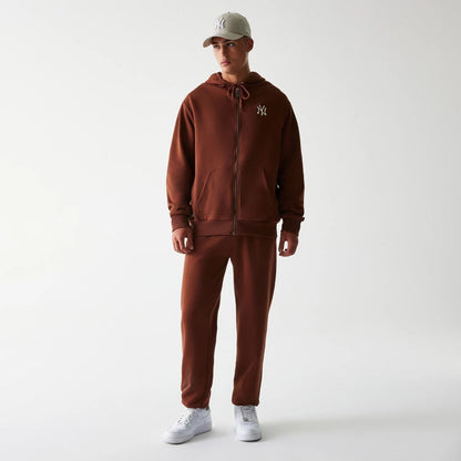 The Male model is wearing New York Yankees MLB Midi League Essential Brown Joggers 8