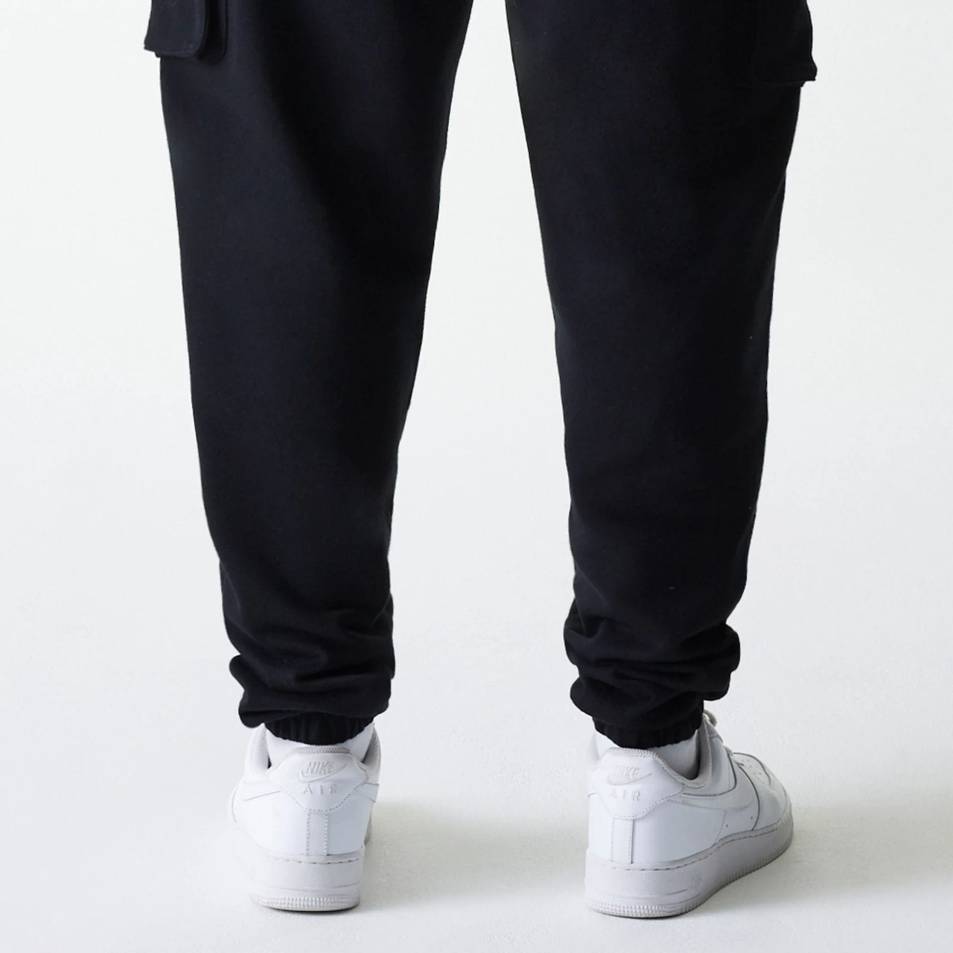 The Male model is wearing New Era Black Cargo Joggers 6