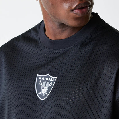 The Male model is wearing Las Vegas Raiders NFL Essentials Black Oversized Mesh T-Shirt 4