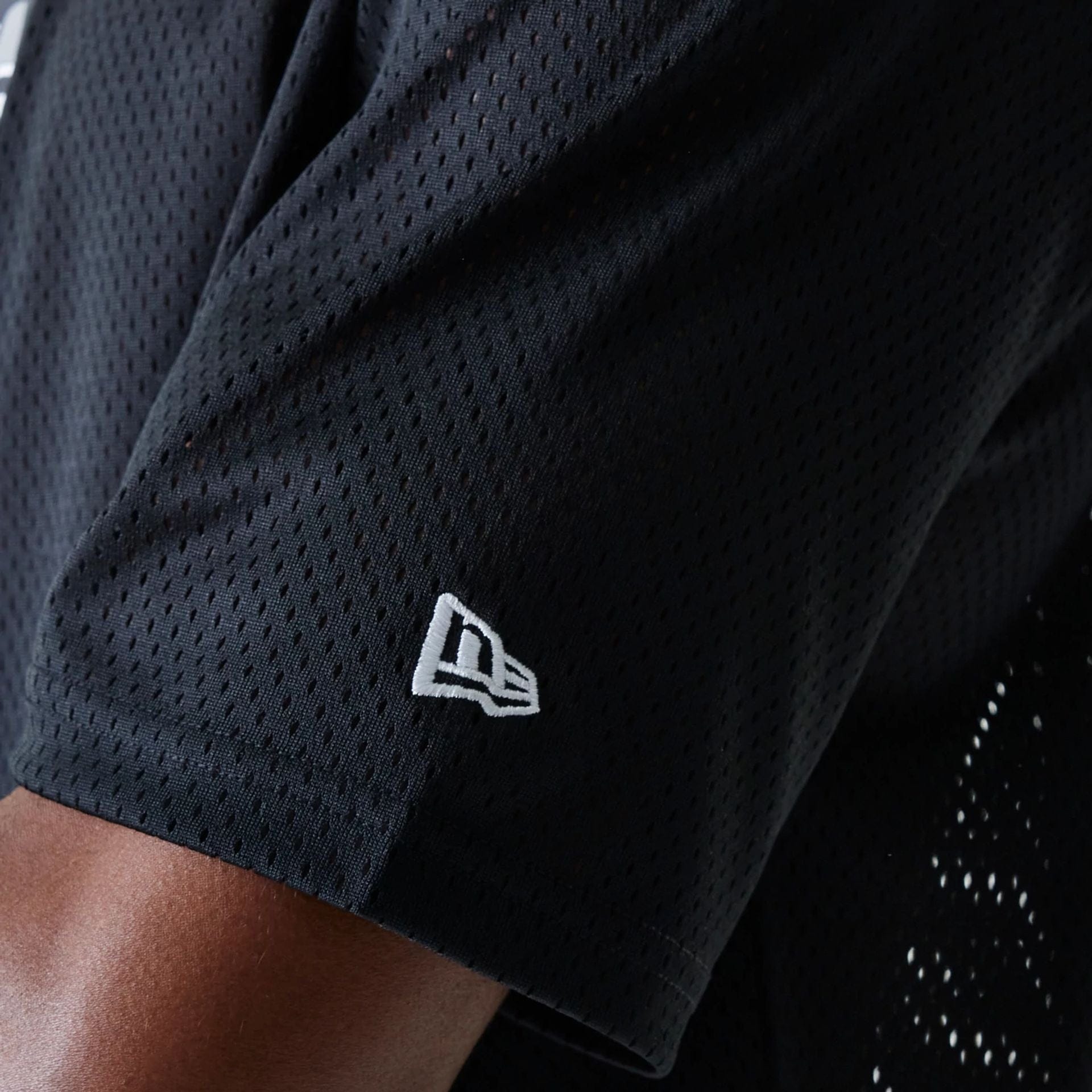 The Male model is wearing Las Vegas Raiders NFL Essentials Black Oversized Mesh T-Shirt 5