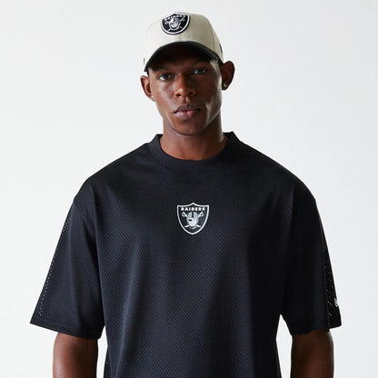 The Male model is wearing Las Vegas Raiders NFL Essentials Black Oversized Mesh T-Shirt 6