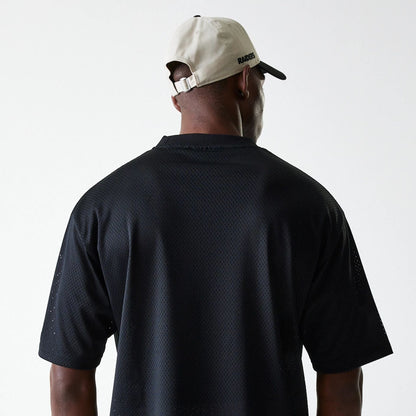 The Male model is wearing Las Vegas Raiders NFL Essentials Black Oversized Mesh T-Shirt 7