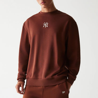 The Male model is wearing New York Yankees MLB Midi League Essential Brown Oversized Crew Neck Sweater 3