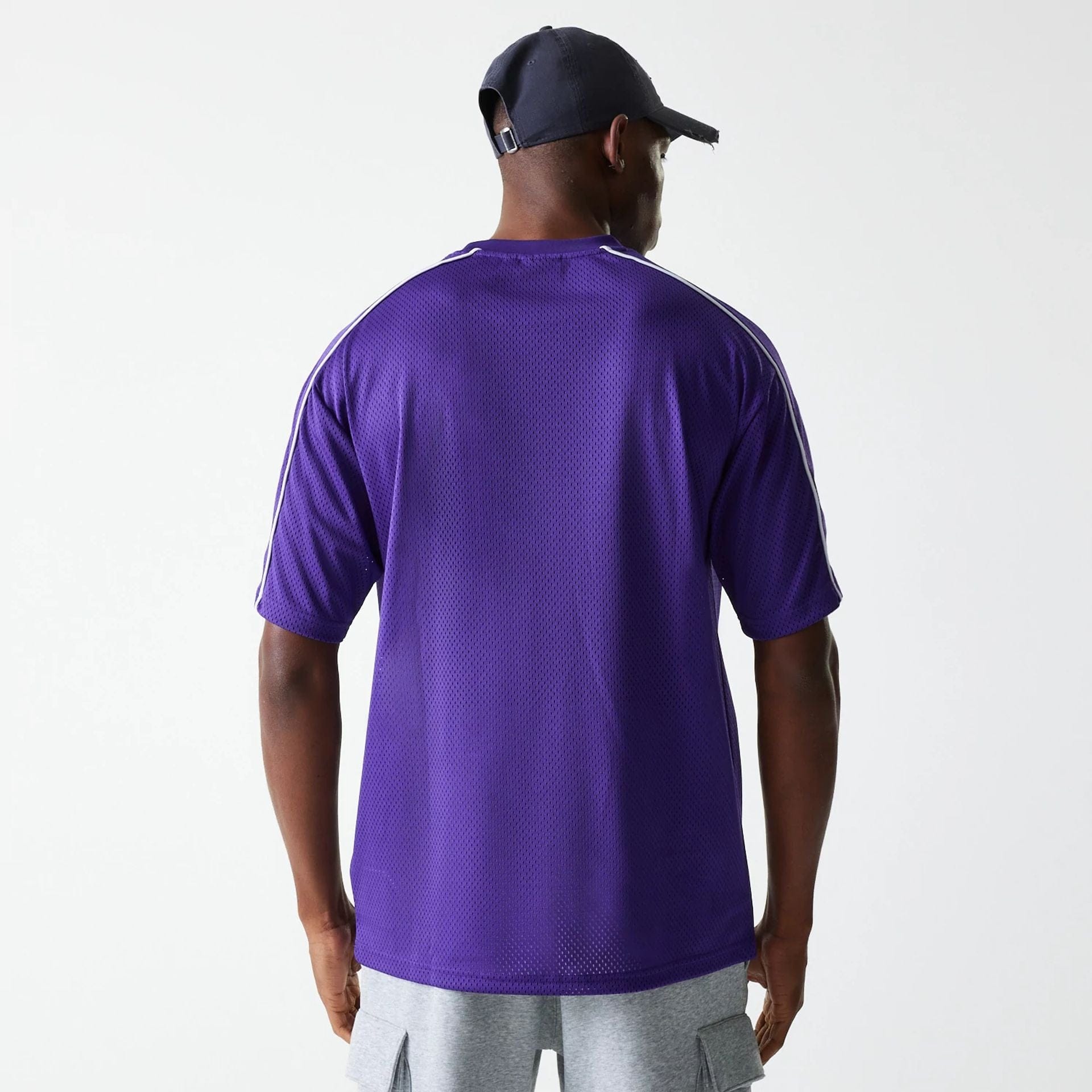 The Male model is wearing LA Lakers NBA Piping Purple Oversized Mesh T-Shirt 2