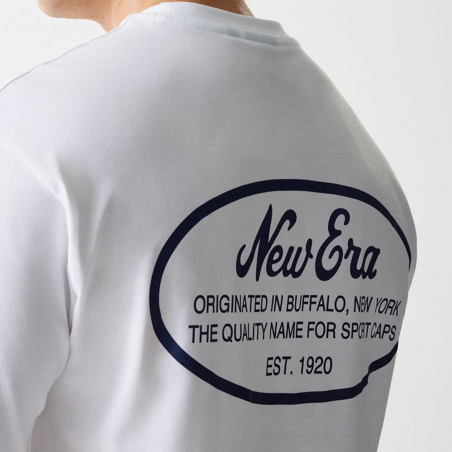 The Male model is wearing New Era Trucker Patch White Oversized T-Shirt 6