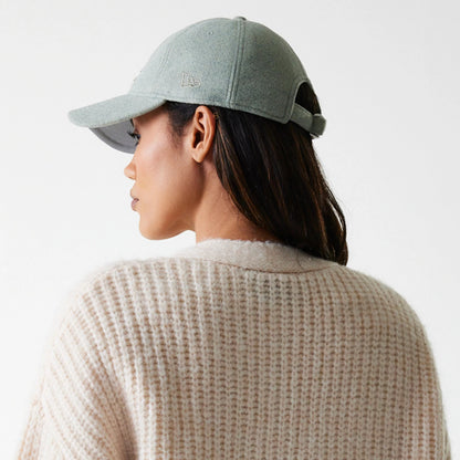 New Era LA Dodgers Womens MLB Knit Light Beige Cardigan, on a model wearing a textured waffle knit design with a light beige hue, paired with a grey cap featuring the embroidered New Era flag logo on the left side.