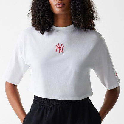 The Female model is wearing New York Yankees Womens League Essential Midi White Crop T-Shirt 3