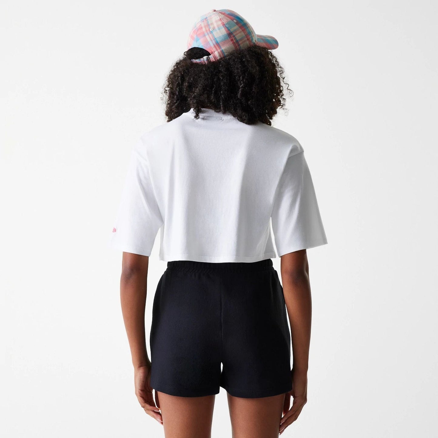 The Female model is wearing New York Yankees Womens League Essential Midi White Crop T-Shirt 2