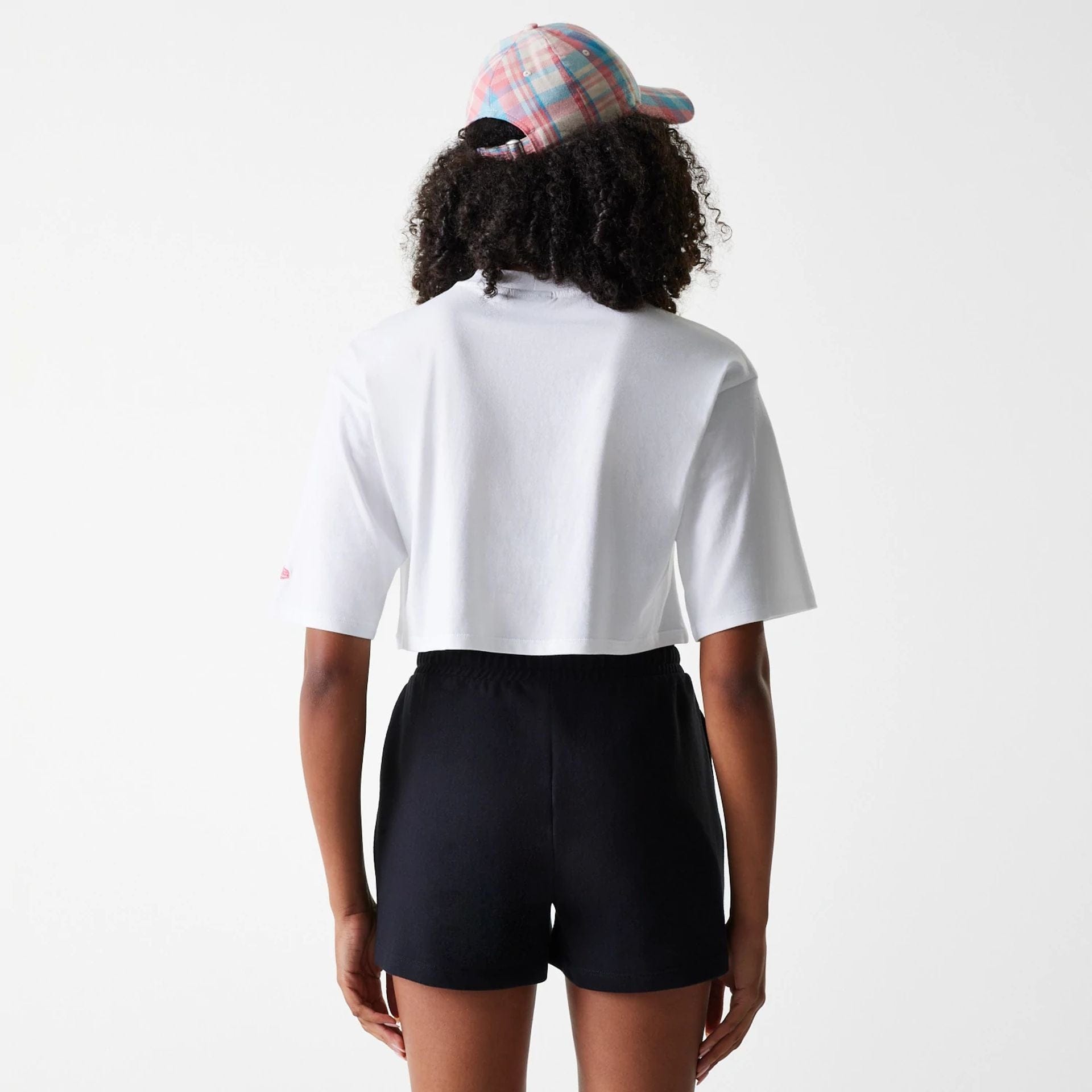 The Female model is wearing New York Yankees Womens League Essential Midi White Crop T-Shirt 2