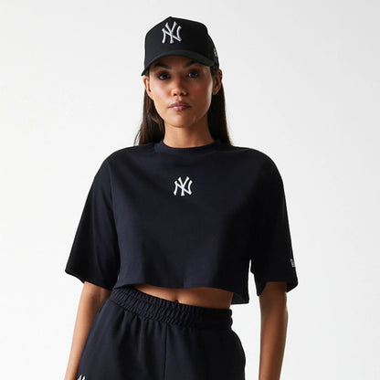The Female model is wearing New York Yankees Womens League Essential Midi Black Crop T-Shirt 3