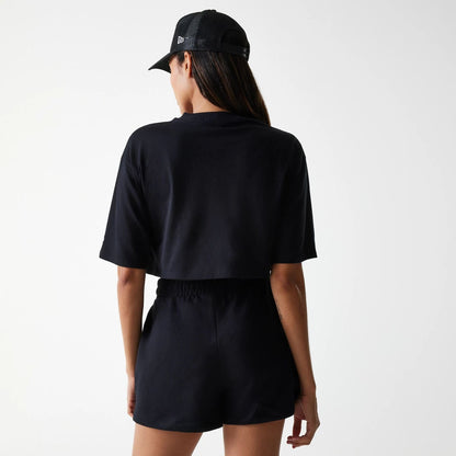 The Female model is wearing New York Yankees Womens League Essential Midi Black Crop T-Shirt 2