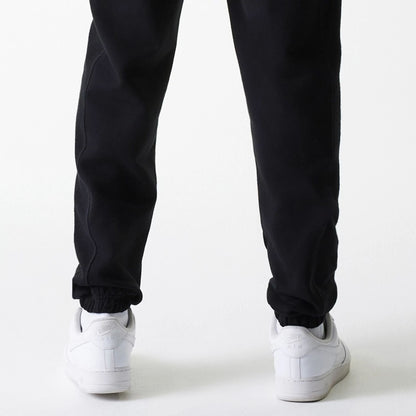 The Male model is wearing Chicago Bulls NBA Arch Graphic Black Joggers 7