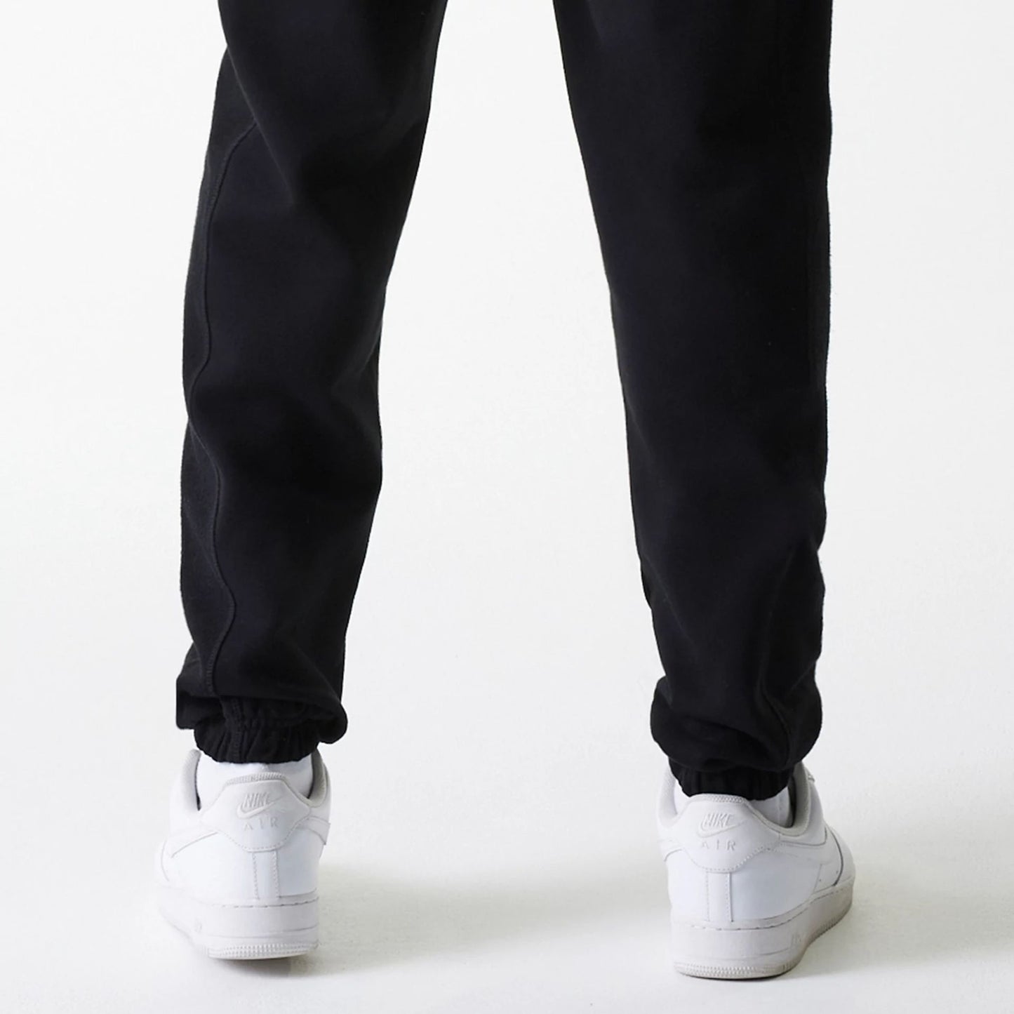 The Male model is wearing Chicago Bulls NBA Arch Graphic Black Joggers 7