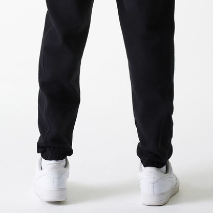 The Male model is wearing Chicago Bulls NBA Arch Graphic Black Joggers 7