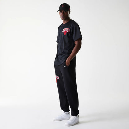 The Male model is wearing Chicago Bulls NBA Arch Graphic Black Joggers 8