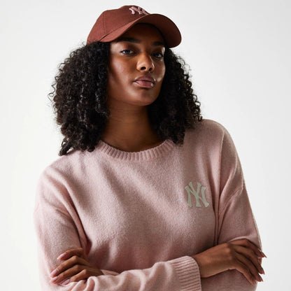 The Female model is wearing New York Yankees Womens MLB Knit Pastel Pink Crew Neck Sweater 4